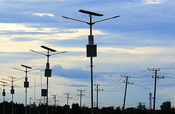istock Rows of solar powered light poles lighting the highway 2235249106