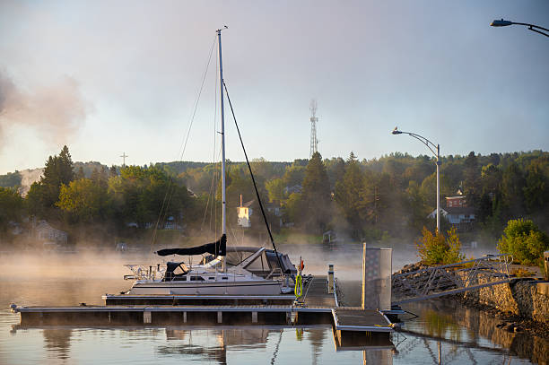 Morning fog over Megantic Lake at the marina