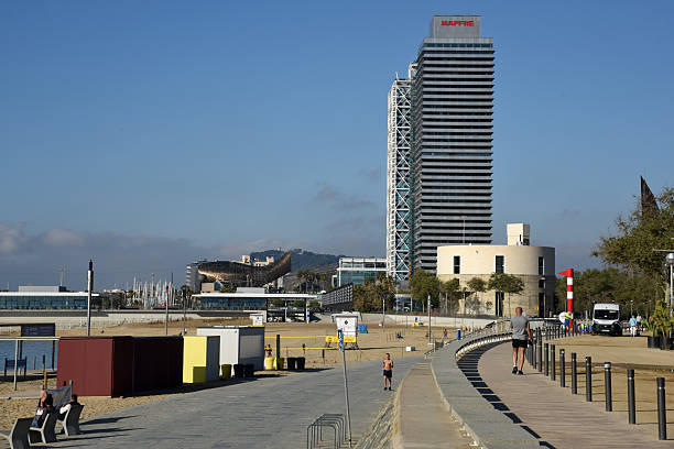 Two tall buildings in Barcelonda City close to the beach. Captured during a sunny day in spring season.