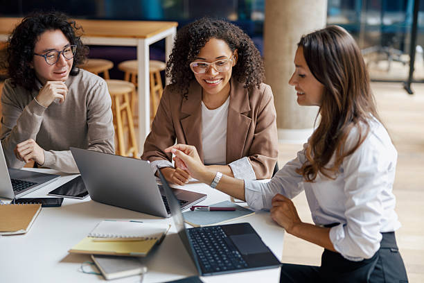 istock A group of diverse women engaging in collaboration within a thriving modern office environment 2235255655