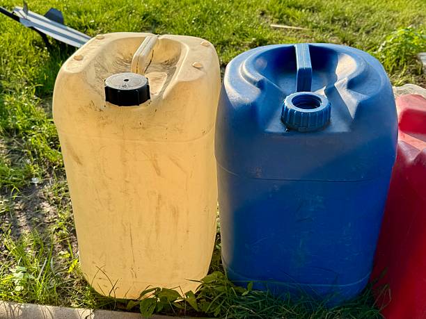 istock Plastic fuel canisters in different colors outdoors 2235256040