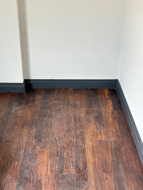 istock Dirty and dusty parquet floor and wall 2235260226