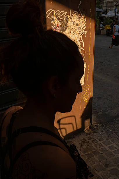 Girl walks through the streets of the old town of Zaragoza, Spain. His back is turned and he is unrecognizable
