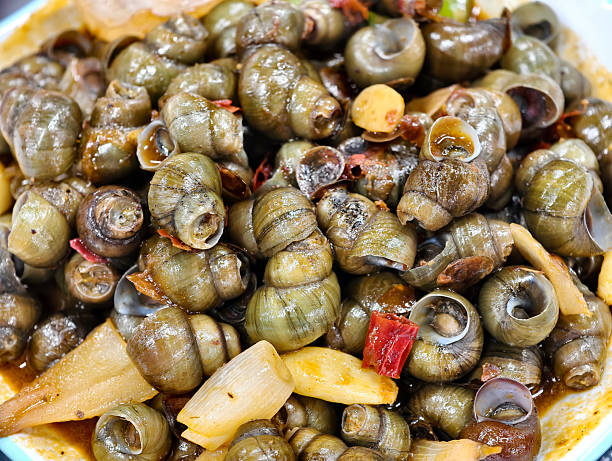 istock Close-up of stir-fried snails 2235283883