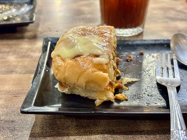 istock Savory melt, delectable sandwich topped cheese on a plate with silver utensils, a culinary delight perfect for gastronomy enthusiasts seeking restaurant flavor, food photography, tempting cuisine, 2235290947