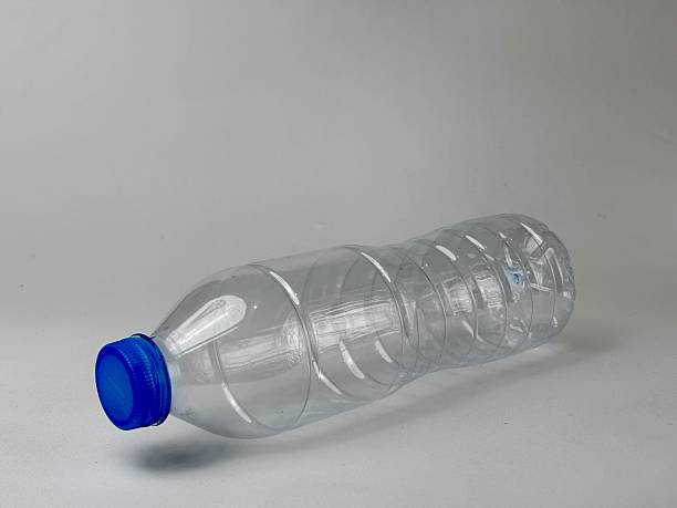 istock Empty transparent plastic bottle with a vivid blue cap on a clean white surface showcasing environmental awareness and recycling concept highlighting sustainability and eco-friendly practices 2235291265