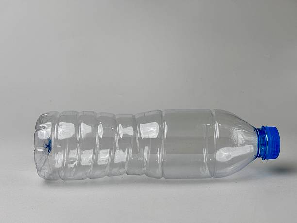 istock Empty clear plastic bottle with a blue cap on a neutral background showcasing recycling concept and lightweight design for sustainable packaging and reusable water container design 2235291272