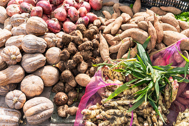 A close-up shot at a market focuses on sweet potatoes, a common crop in Taiwan, can be enjoyed in various ways, such as baked, as sweet potato balls, or in sweet potato cakes.