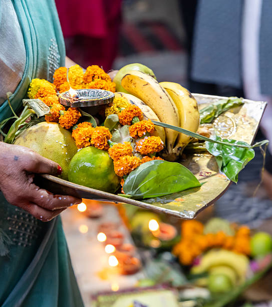 istock hindu devotee performing holy rituals with daali offerings at chhath puja celebration 2235293986