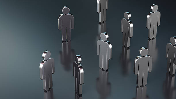 Metallic figures arranged on a glossy surface creating a conceptual representation of community and public communication.