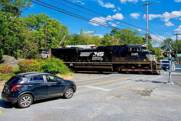 Shepherdstown, West Virginia, USA - September 7, 2025: Norfolk Southern Railway locomotive #1095 pulling a freight train passes through Shepherdstown on a sunny afternoon.
