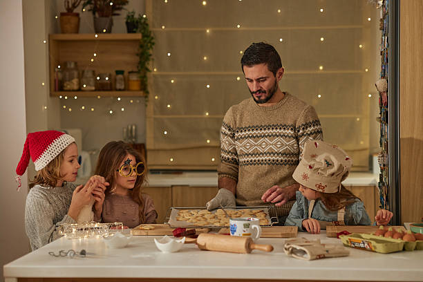 istock Beautiful family making Christmas cookies 2235300751