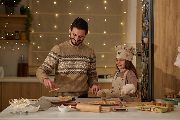 Beautiful family making Christmas cookies
