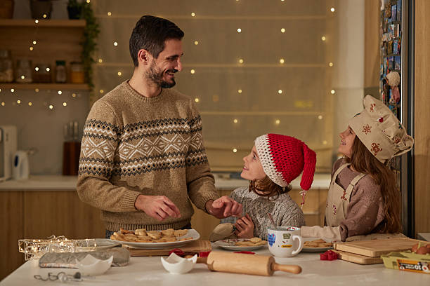 istock Beautiful family making Christmas cookies 2235301631