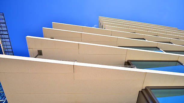istock Downtown corporate business district architecture. Glass reflective office buildings against blue sky and sun light. 2235308670
