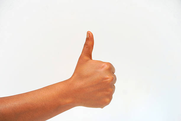istock Hand showing thumb up sign on white background 2235311354