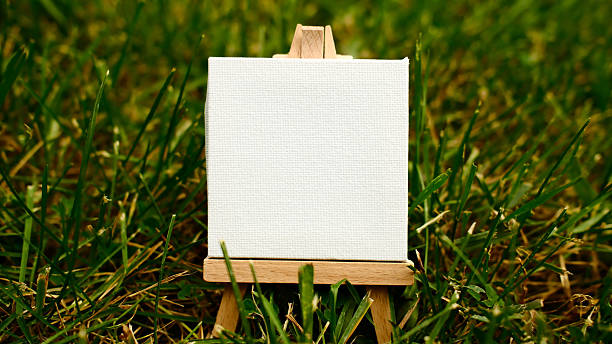 mini easel close up on green grass lawn