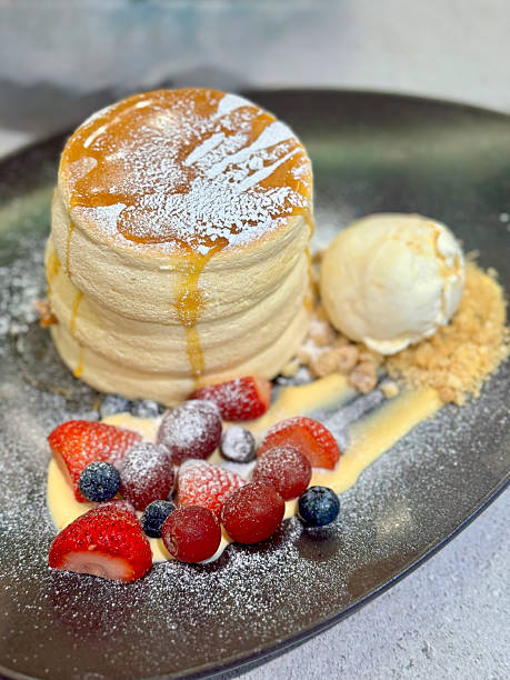 istock Souffle pancakes with fresh berries and ice cream 2235317811