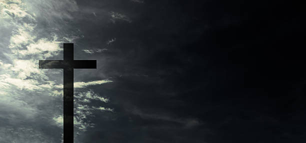 istock Cross christ on sky dark 2235318390