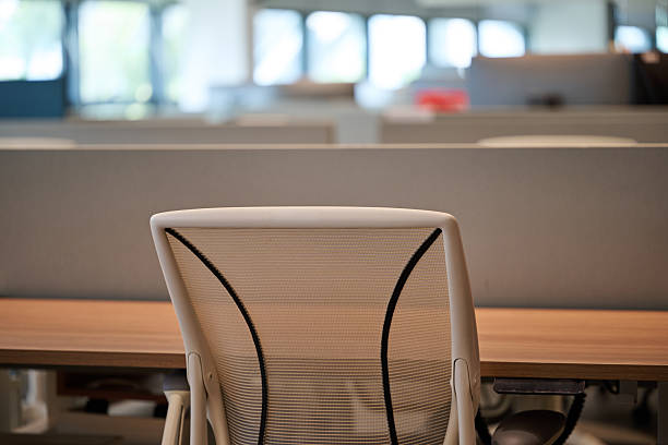 istock An Empty Workstation in a Modern Office Environment Featuring Ergonomic Chair and Wooden Desk 2235318726