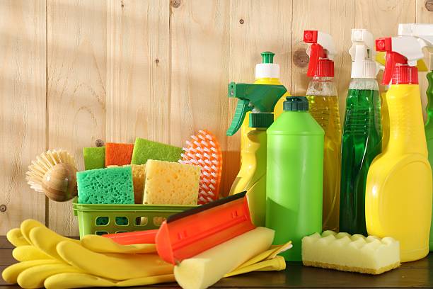 istock Different cleaning products and supplies on wooden table 2235321763