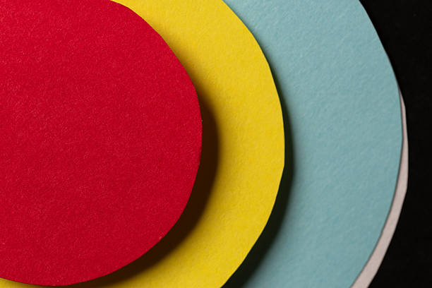 A background of overlapping colorful circular construction paper