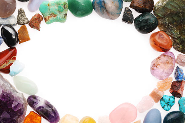 istock Frame of different natural mineral stones isolated on white, top view 2235323573