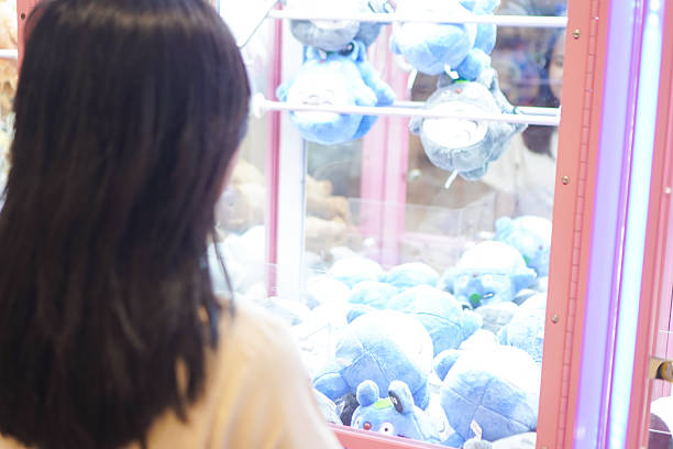 istock Female Playing Claw Toy Game 2235326468