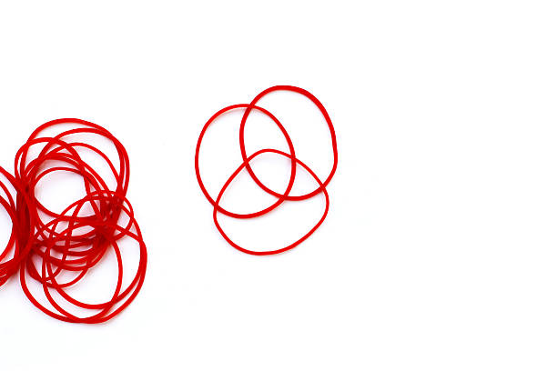 istock Close-up of circular red rubber bands. 2235326527