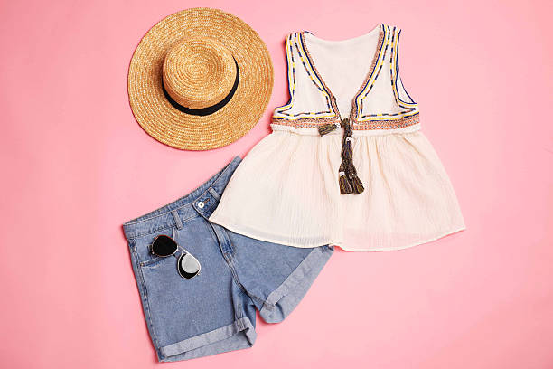 istock Stylish clothes and accessories on pink background, flat lay 2235326553