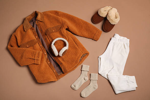 istock Stylish clothes, boots and accessories on beige background, flat lay 2235326626