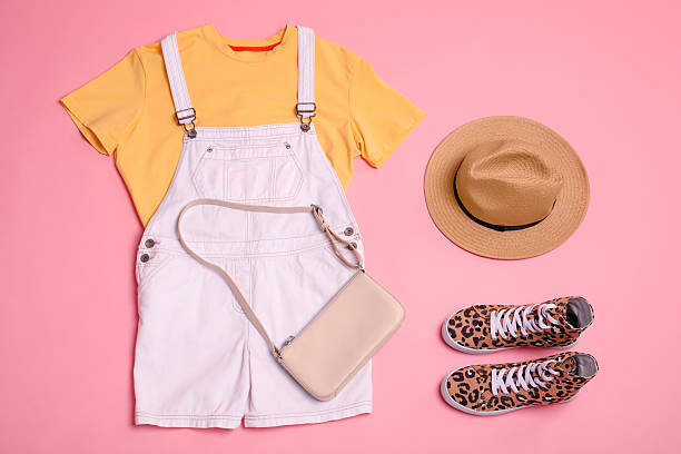 istock Stylish clothes, sneakers and accessories on pink background, flat lay 2235326629