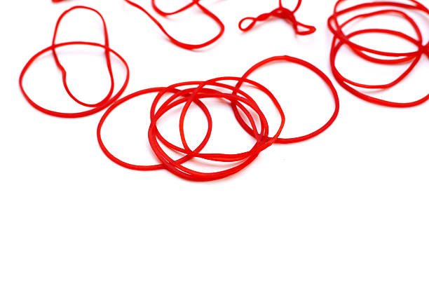 istock Close-up of circular red rubber bands. 2235327423