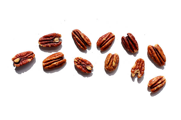 istock Delicious salted pecan nuts scattered. 2235328659