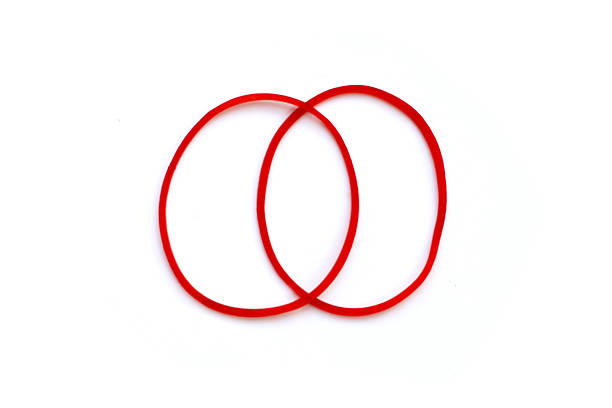 istock Close-up of circular red rubber bands. 2235330806