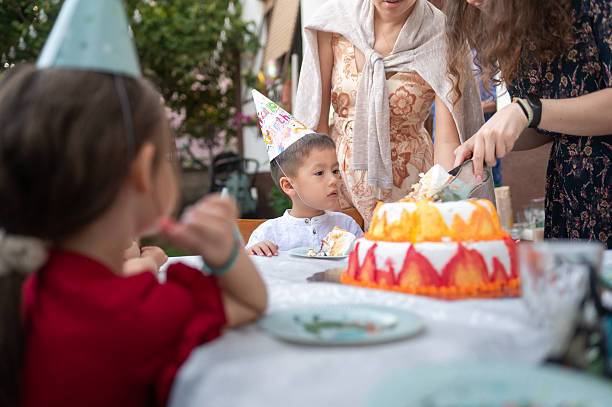 istock Child Watching Cake Being Served During A Birthday Celebration 2235331571