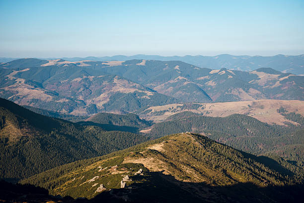 istock Scenic Mountain Landscape with Rolling Hills 2235332330