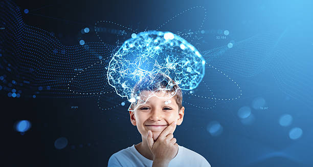 istock Smiling boy with illuminated brain network above his head symbol 2235333659