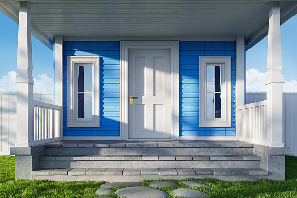 Front porch of a modern blue house with white door, vertical windows, and concrete steps, 3D Rendering on a sunny outdoor background, home entrance concept