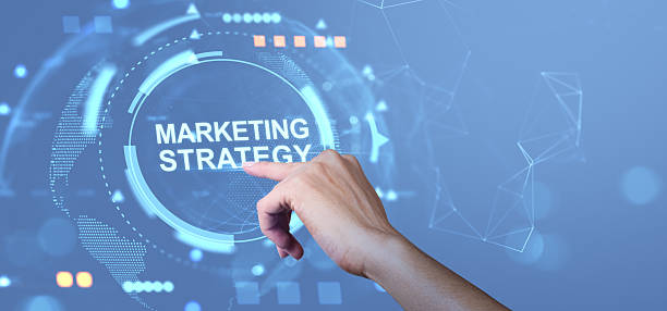 istock Marketing strategy concept with hand interacting with futuristic digital interface on blue background in modern business theme.. 2235333933