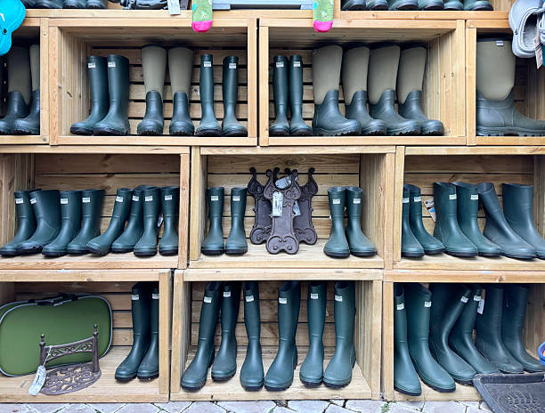 Display of waterproof boots for sale in a shop in Sherborne, Dorset. September 2025