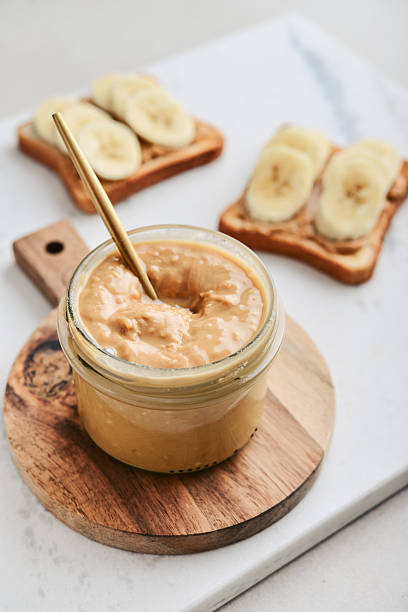 istock Creamy and smooth peanut butter in jar 2235338827
