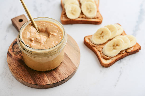 istock Creamy and smooth peanut butter in jar 2235338830