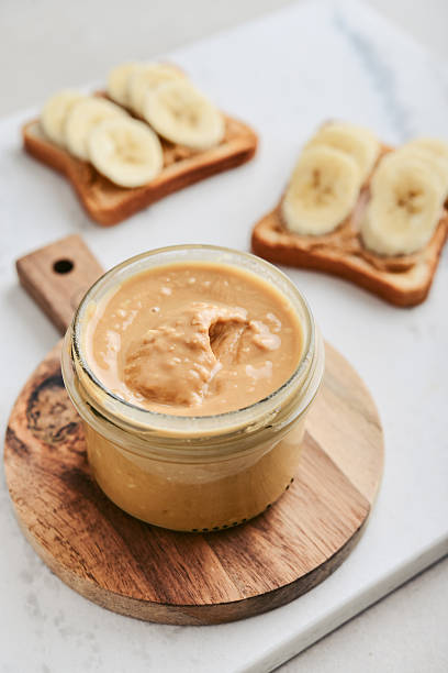istock Creamy and smooth peanut butter in jar 2235338833
