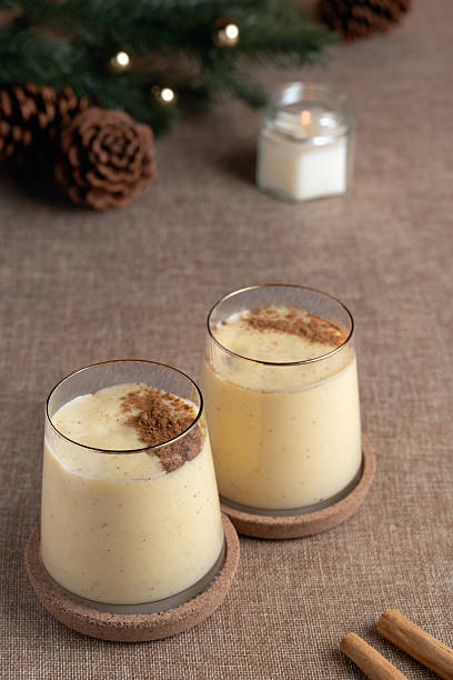 istock Two glasses of eggnog with cinnamon 2235345127