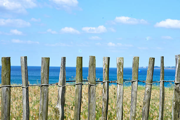 istock Fence and blue sea and blue sky 2235346315