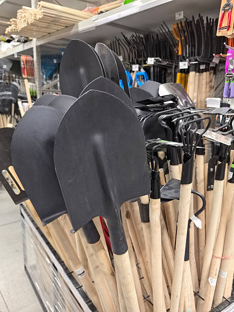 istock Garden tools lined up for selection in a bright retail store space 2235346788
