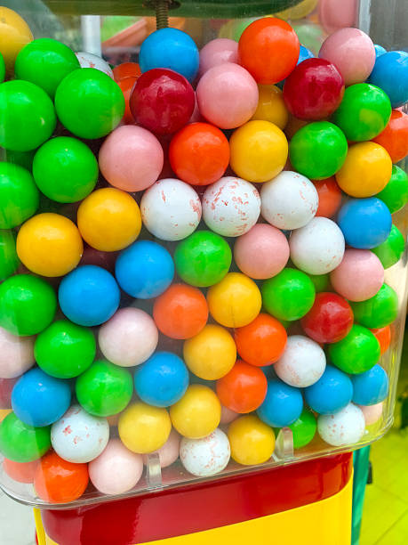 istock Colorful gumballs in a vending machine delight young and old alike 2235346799