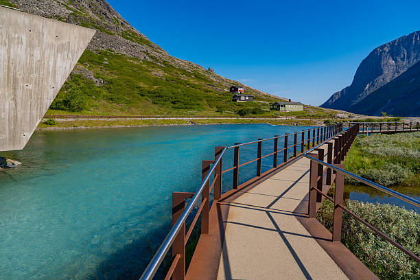 Sunny day Trollstigen river walkway viewpoint information center Norway summer travel tourism