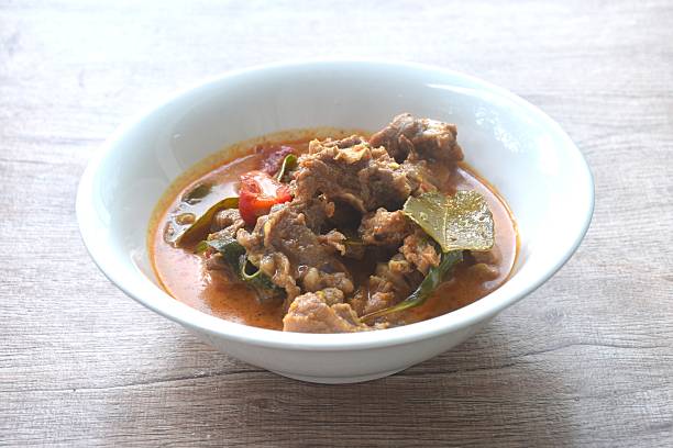 istock spicy boiled slice beef with lemon leaf in coconut milk red curry soup 2235347627
